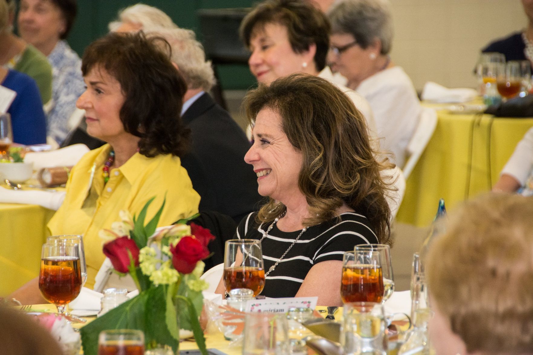 Attendees of the event react to the speaker at the Friends of Miriam Luncheon